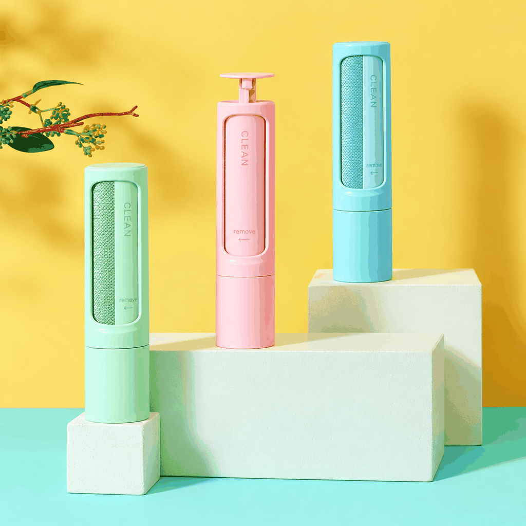 Drei wiederverwendbare PetClean™ Tierhaarentferner in Mintgrün, Rosa und Blau mit strukturierten Reinigungsflächen